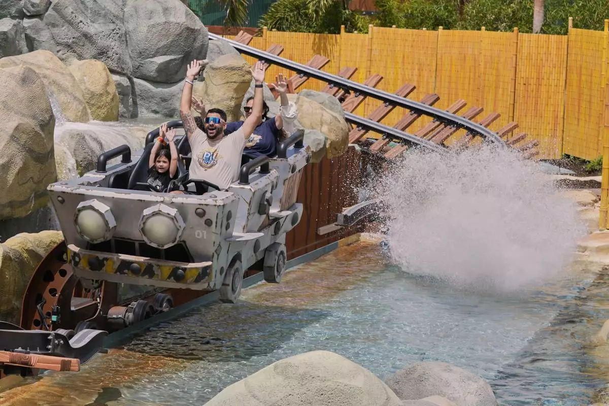 Guests ride the Mine-Cart Madness coaster in Super Nintendo World at Epic Universe at Universal Resort Orlando Thursday, April 10, 2025, in Orlando, Fla. (AP Photo/John Raoux)