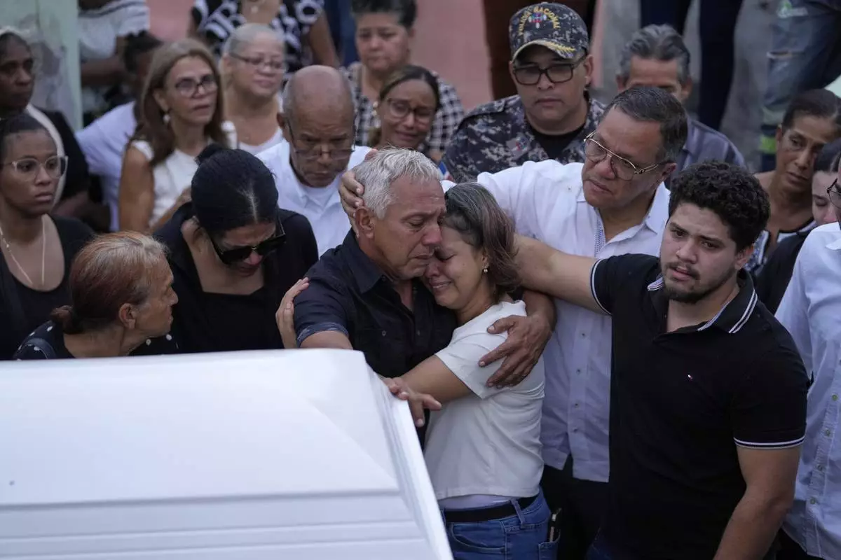 Family and friends attend the funeral of Marilenny Pilarte who died at the Jet Set nightclub when its roof collapsed, in Haina, Dominican Republic, Thursday, April 10, 2025. (AP Photo/Matias Delacroix)