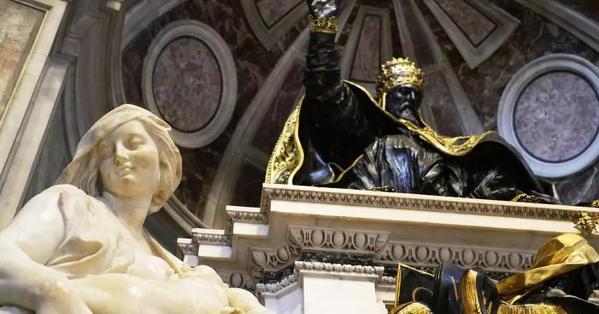Pope makes another surprise appearance at St. Peter's, greeting restorers of papal tombs