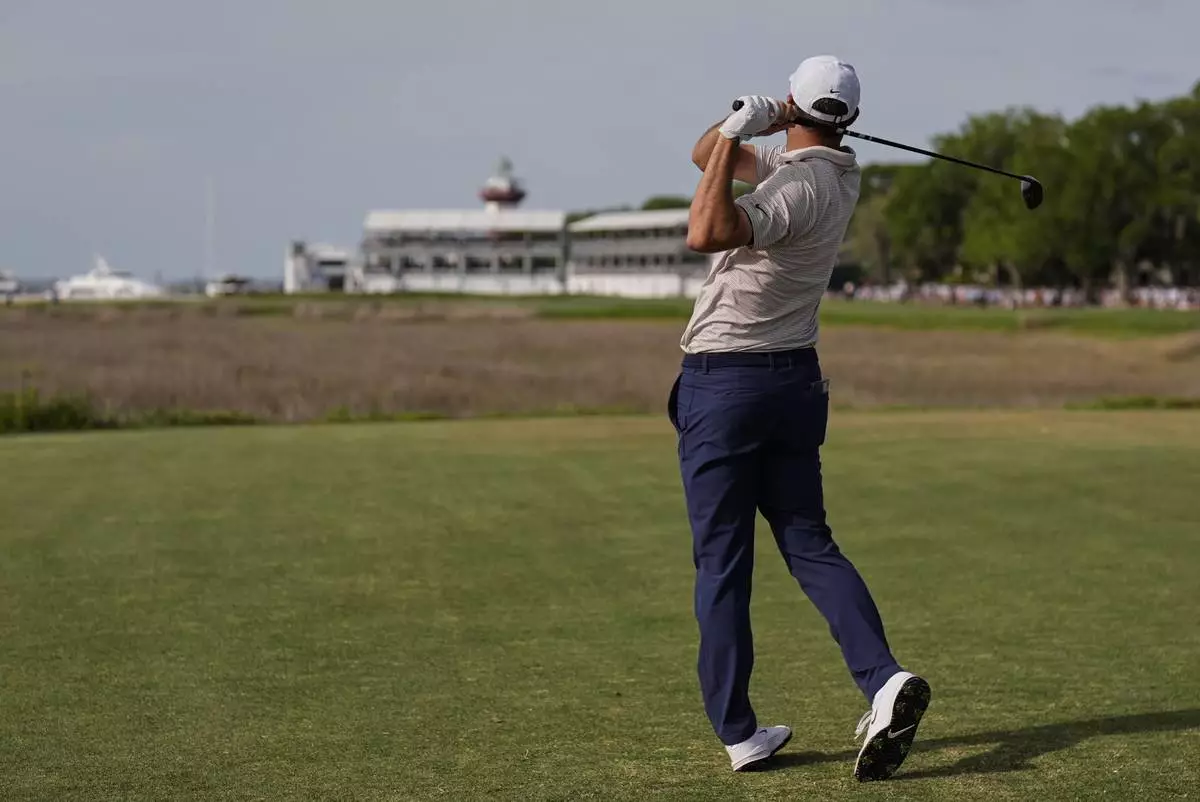 Scottie Scheffler watches his drive from the 18th tee during the final round of the RBC Heritage golf tournament, Sunday, April 20, 2025, in Hilton Head Island, S.C. (AP Photo/Mike Stewart)