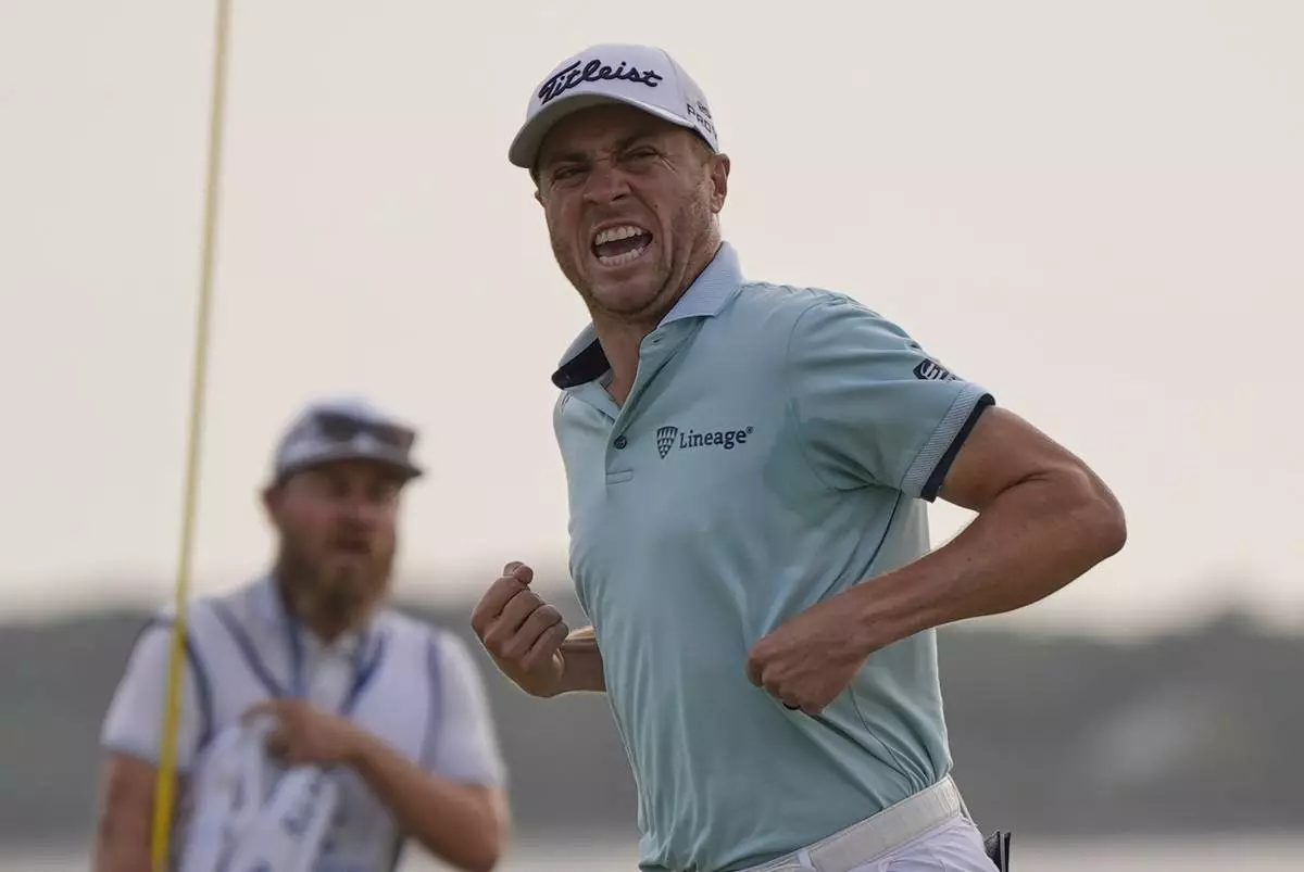 Justin Thomas celebrates after winning the RBC Heritage golf tournament, Sunday, April 20, 2025, in Hilton Head Island, S.C. (AP Photo/Mike Stewart)
