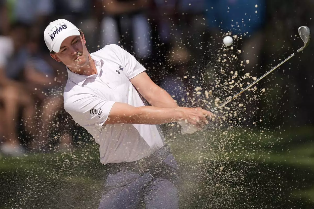 Maverick McNealy hits out of the bunker on the seventh hole during the final round of the RBC Heritage golf tournament, Sunday, April 20, 2025, in Hilton Head Island, S.C. (AP Photo/Mike Stewart)