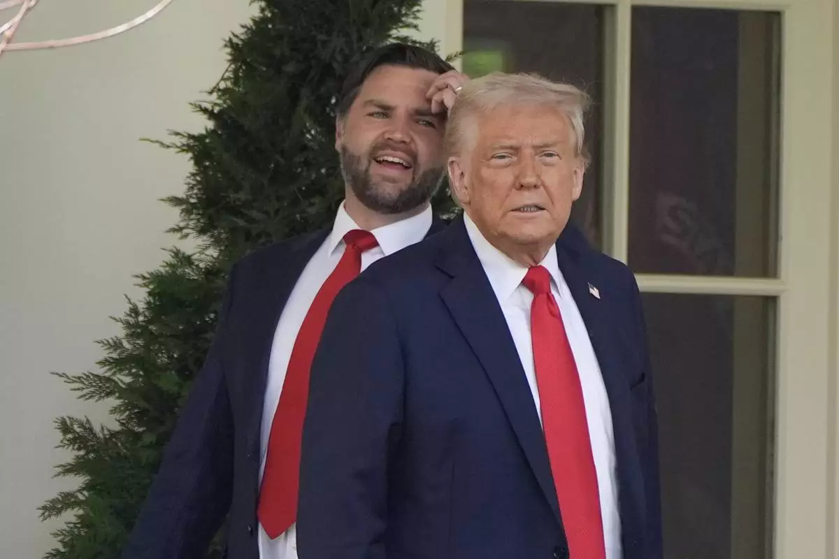 FILE - President Donald Trump and Vice President JD Vance pause near the Oval Office after and event to welcome the 2025 College Football National Champions, the Ohio State University football team on the South Lawn of the White House, April 14, 2025, in Washington. (AP Photo/Alex Brandon, File)