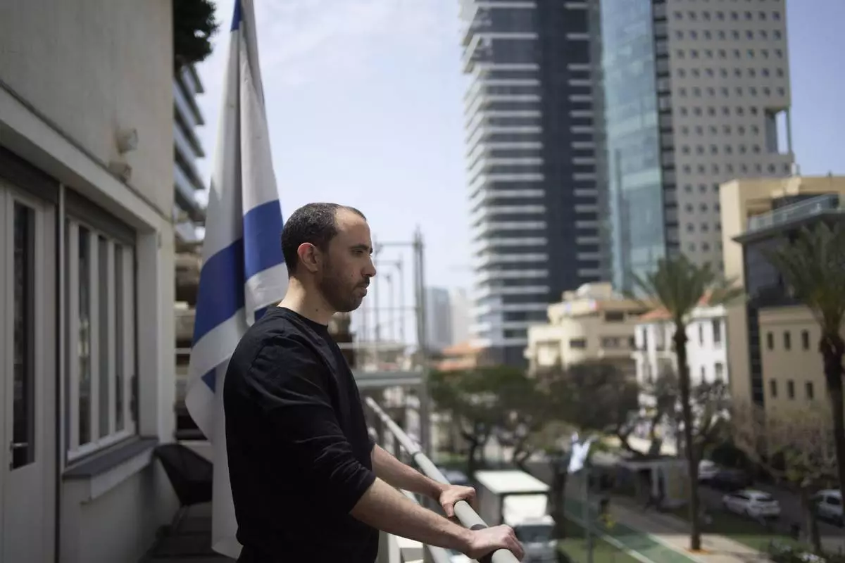 Freed Israeli hostage Tal Shoham, who was held by Hamas militants in the Gaza Strip, poses for a portrait in Tel Aviv, Israel, Tuesday, April 22, 2025. (AP Photo/Maya Alleruzzo)