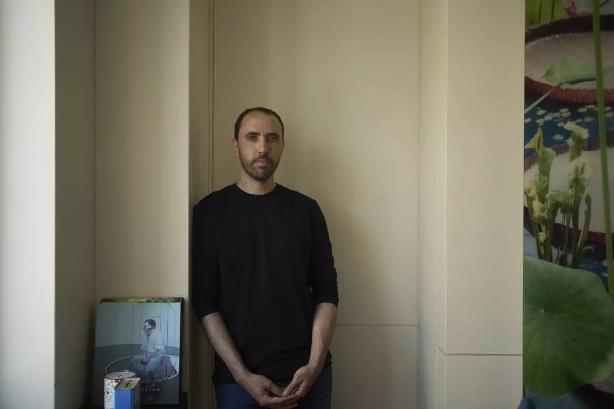 Freed Israeli hostage Tal Shoham, who was held by Hamas militants in the Gaza Strip, poses for a portrait in Tel Aviv, Israel, Tuesday, April 22, 2025. (AP Photo/Maya Alleruzzo)