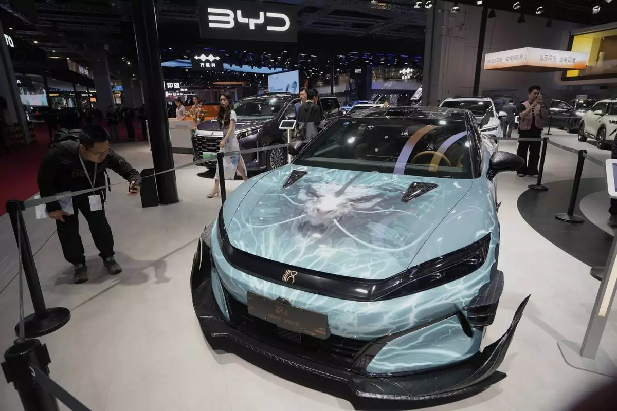 A BYD Han L car model inspired by Black Myth: Wukong is displayed at the Auto Show in Shanghai, Wednesday, April 23, 2025. (AP Photo/Ng Han Guan)