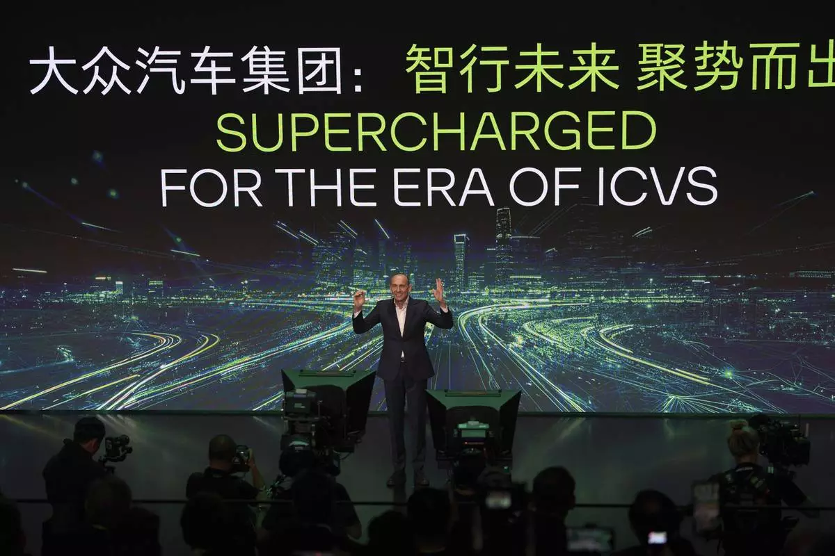 Ralf Brandstatter, Chairman and CEO of Volkswagen Group China, speaks during the media night ahead of the Auto Show in Shanghai, Tuesday, April 22, 2025. (AP Photo/Ng Han Guan)