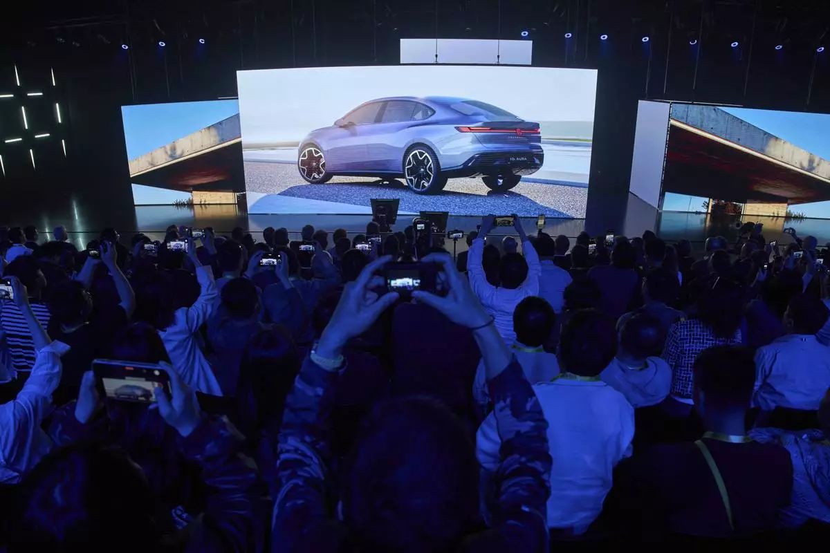 The ID Aura concept car is shown during the Volkswagen Group media night ahead of the Auto Show in Shanghai, Tuesday, April 22, 2025. (AP Photo/Ng Han Guan)