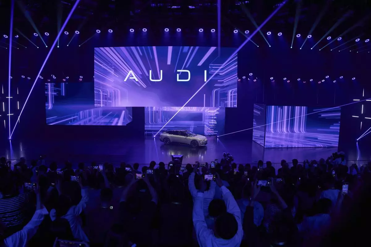 The Audi E5 Sportback is launched during the Volkswagen Group media night ahead of the Auto Show in Shanghai, Tuesday, April 22, 2025. (AP Photo/Ng Han Guan)