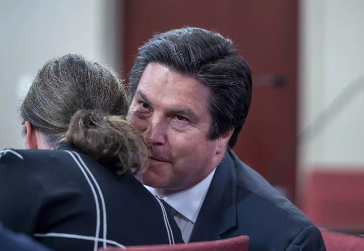 Attorney Kurt Sommer talks with his client Julia Peters, who is representing the estate of actor Gene Hackman and his wife Betsy Arakawa Hackman, in a case regarding the release of public records in First District Court, Monday, March 31, 2025, in Santa Fe, N.M. (Eddie Moore/The Albuquerque Journal via AP)