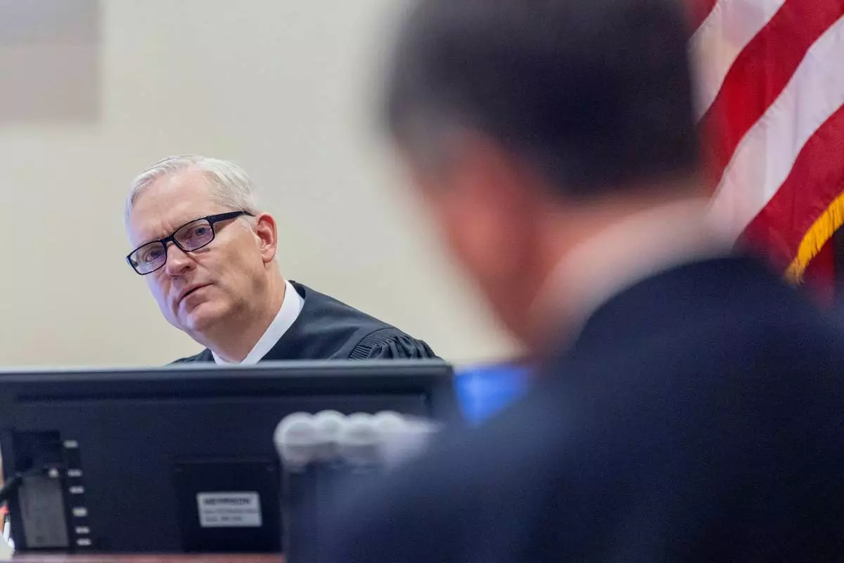 Judge Matthew J. Wilson listens to arguments by attorney Greg Williams, representing the media interveners in the Gene Hackman and his wife, Betsy Arakawa case, regarding the release of public records in District Court in Santa Fe, N.M., Monday, March 31, 2025. (Michael G. Seamans/Santa Fe New Mexican via AP, Pool)