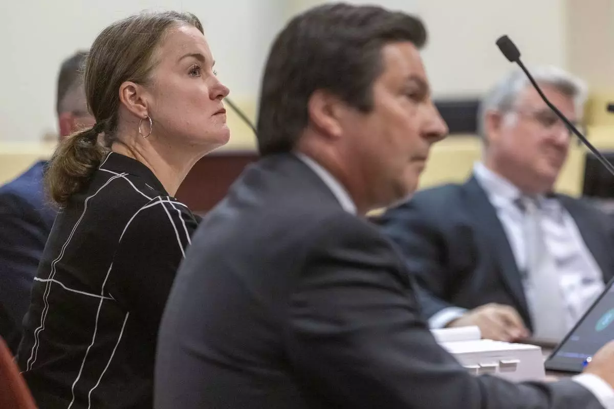 Julia Peters, left, Hackman family estate representative sits with attorney, Kurt Sommer, before Judge Matthew J. Wilson in a court hearing on the release of public records in District Court in Santa Fe, N.M., on Monday, March 31, 2025. (Michael G. Seamans/Santa Fe New Mexican via AP, Pool)