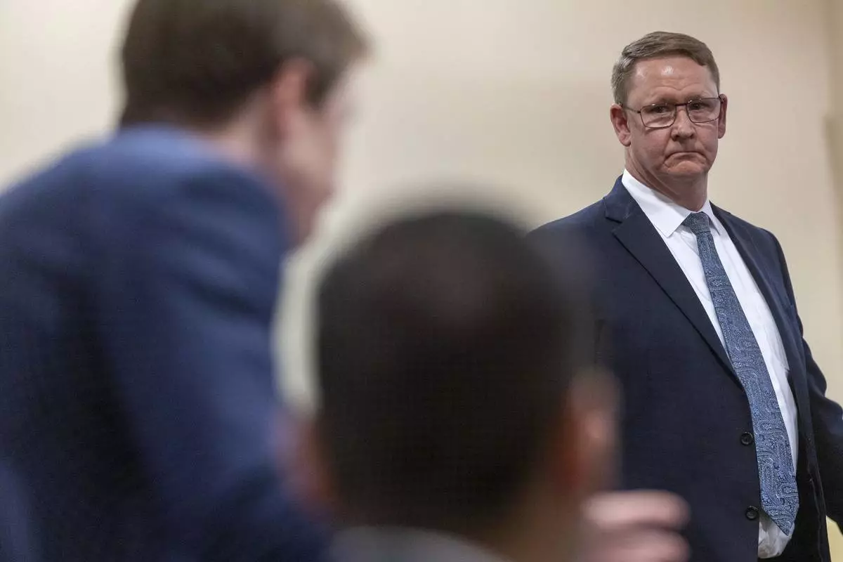 Gary Coffin, co-council for the Hackman estate, looks to Santa Fe County attorney, Walker Boyd, left, and and Peter Valencia, center, during witness testimony in the Hackman estate privacy case before Judge Matthew J. Wilson in District Court in Santa Fe, N.M., Monday, March 31, 2025. (Michael G. Seamans/Santa Fe New Mexican via AP, Pool)