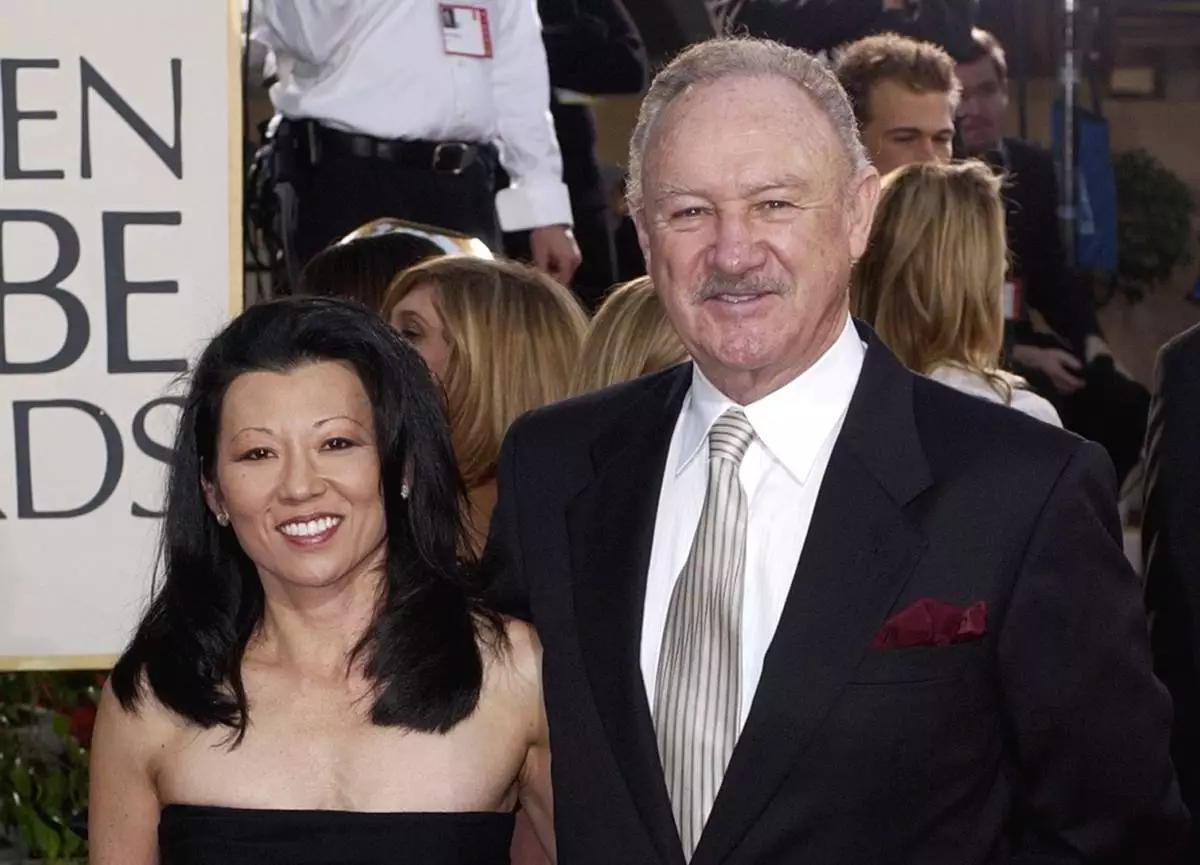 FILE - Actor Gene Hackman arrives with his wife, Betsy Arakawa, for the 60th Annual Golden Globe Awards in Beverly Hills, Calif., Jan. 19, 2003. (AP Photo/Mark J. Terrill, File)