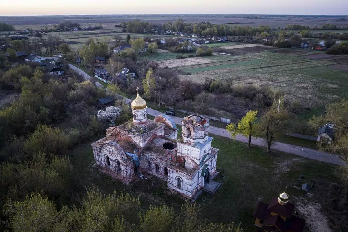 A church destroyed in fighting between Russian and Ukrainian forces is seen from above during celebration of the Orthodox Easter in Lukashivka village, Ukraine, on Sunday, April 20, 2025. (AP Photo/Evgeniy Maloletka)