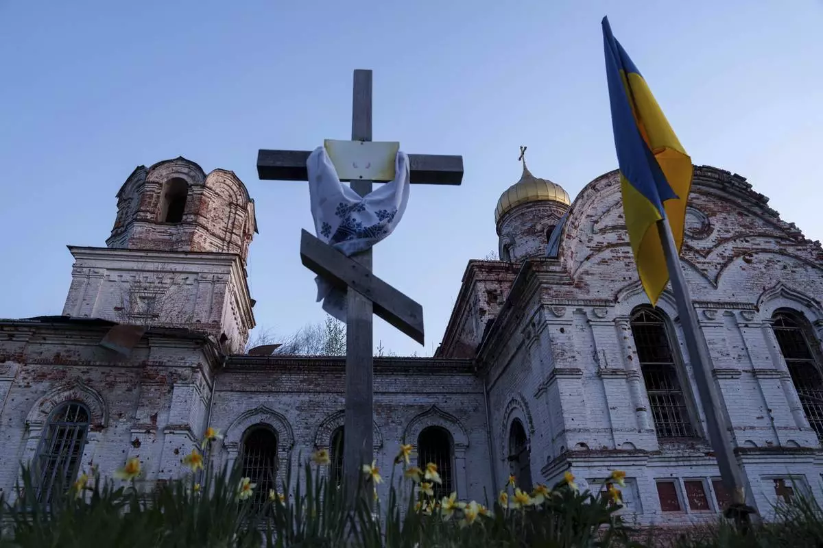 A church destroyed in fighting between Russian and Ukrainian forces is seen during celebration of the Orthodox Easter in Lukashivka village, Ukraine, on Sunday, April 20, 2025. (AP Photo/Evgeniy Maloletka)