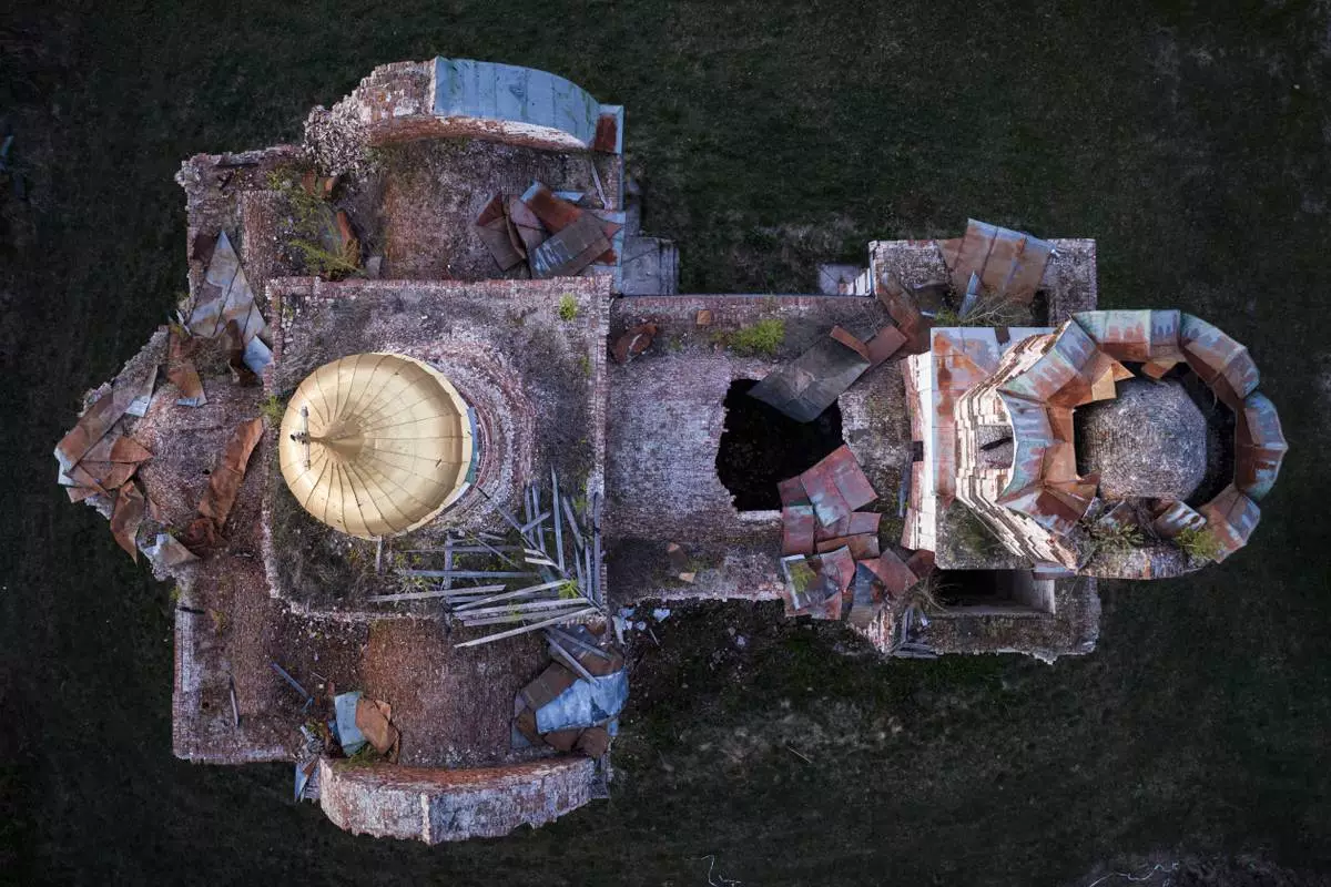 A church destroyed in fighting between Russian and Ukrainian forces is seen from above during celebration of the Orthodox Easter in Lukashivka village, Ukraine, on Sunday, April 20, 2025. (AP Photo/Evgeniy Maloletka)