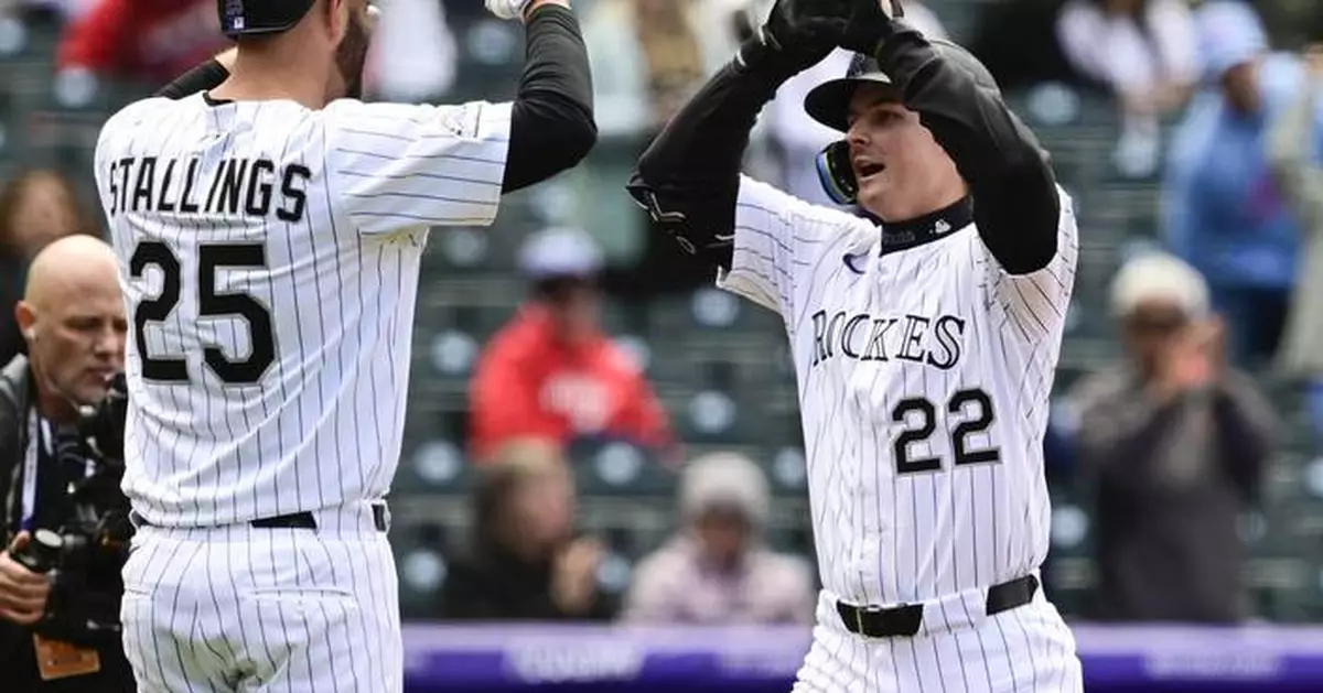 Crews hits 2 of 4 homers by Nationals, who beat Rockies 12-11 after nearly wasting 10-run lead