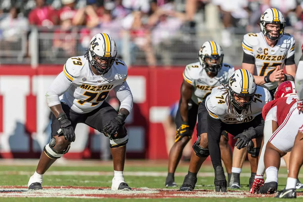 FILE - Missouri offensive lineman Armand Membou (79) sets up at the line of scrimmage during the first half of an NCAA college football game against Alabama, Saturday, Oct. 26, 2024, in Tuscaloosa, Ala. (AP Photo/Vasha Hunt, File)