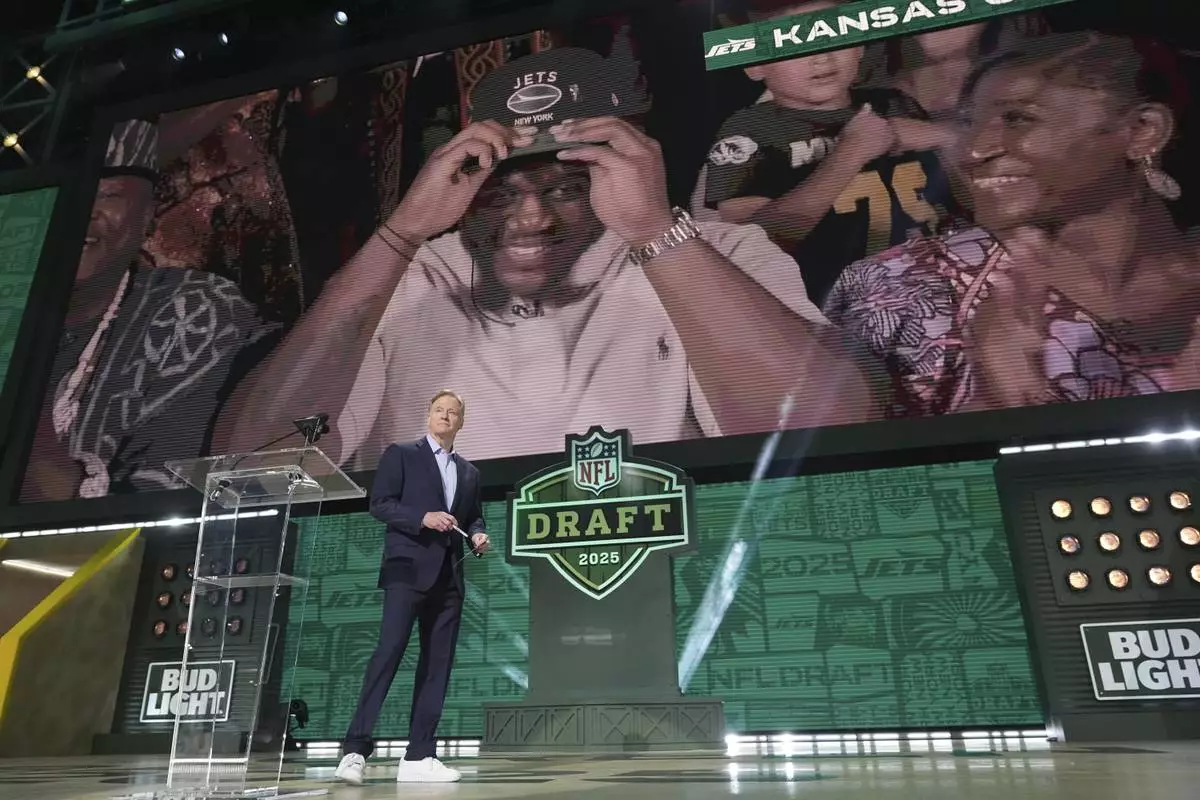 NFL Commissioner Roger Goodell stands on stage after announcing Armand Membou after he was chosen by the New York Jets with the seventh overall pick during the first round of the NFL football draft, Thursday, April 24, 2025, in Green Bay, Wis. (AP Photo/Jeff Roberson)