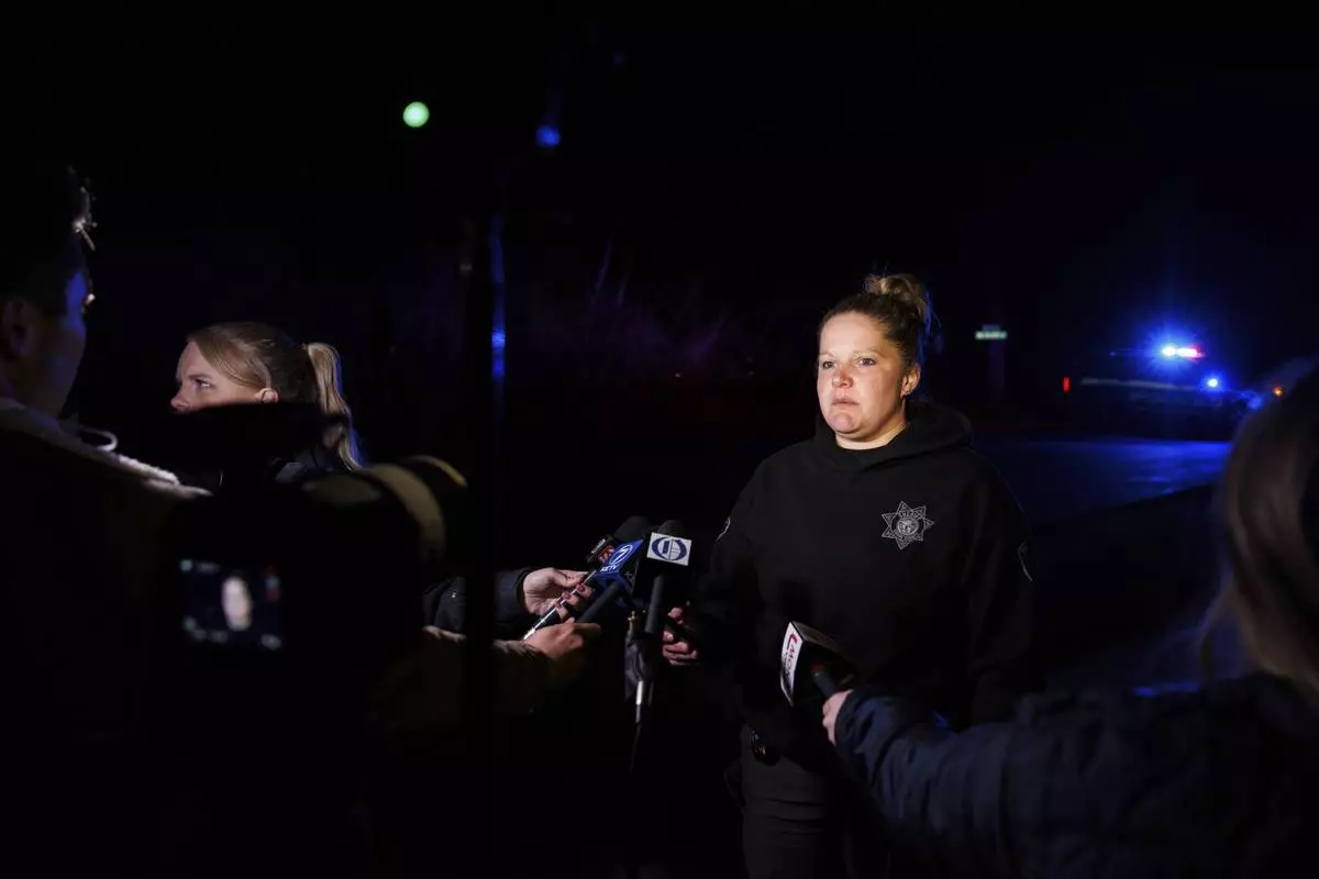 Sgt. Brie Frank, Dodge County Sheriff's Office, speaks to media after a plane crashed into the Platte River killing multiple people Friday, April 18, 2025, in Fremont, Neb. (Nikos Frazier/Omaha World-Herald via AP)