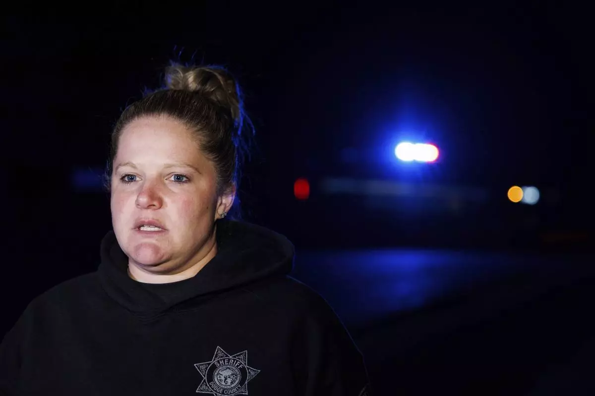 Sgt. Brie Frank, Dodge County Sheriff's Office, speaks to media after a plane crashed into the Platte River killing multiple people Friday, April 18, 2025, in Fremont, Neb. (Nikos Frazier/Omaha World-Herald via AP)