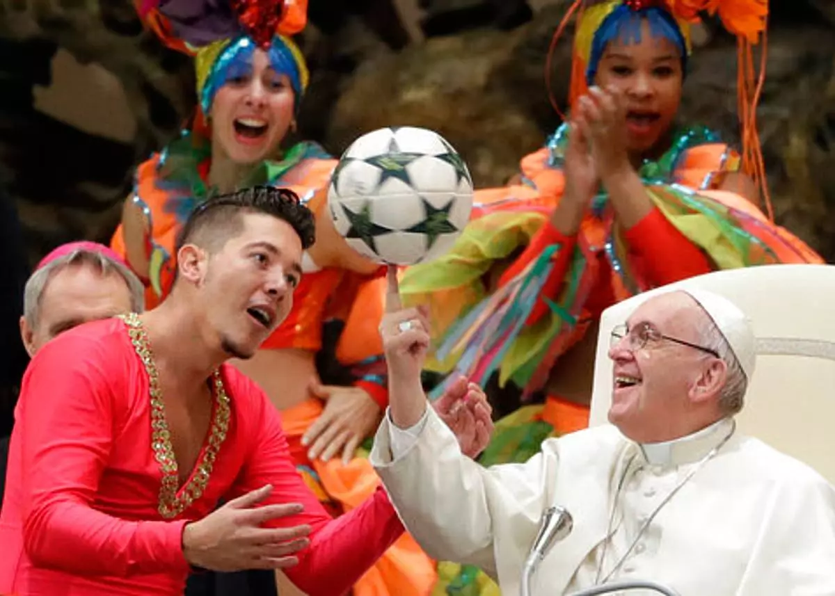 FILE - Pope Francis twirls a soccer ball he was presented by a member of the Circus of Cuba, during his weekly general audience in the Pope Paul VI hall, at the Vatican, Wednesday, Jan. 2, 2019. (AP Photo/Andrew Medichini, file)