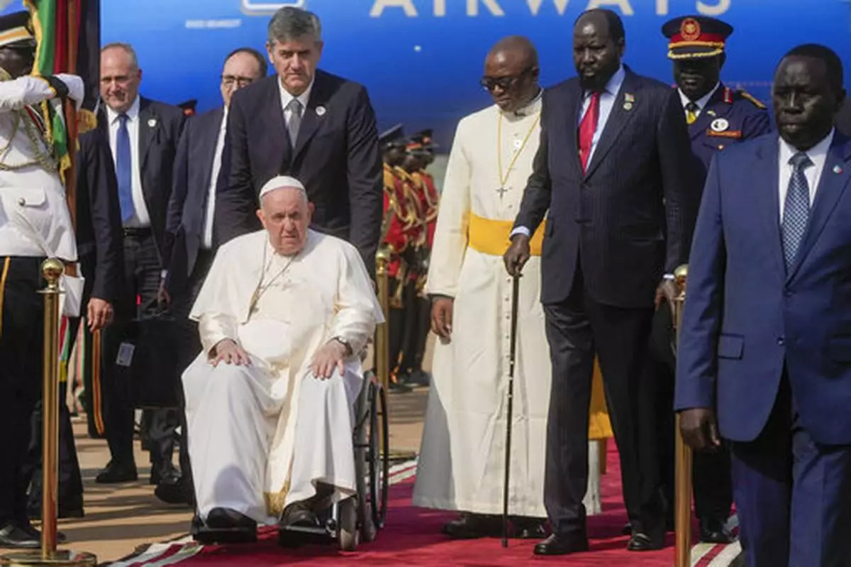 FILE - Pope Francis is welcomed by South Sudan's President Salva Kiir, second from right, upon his arrival at Juba's airport, South Sudan, Friday, Feb. 3, 2023. (AP Photo/Gregorio Borgia, File)