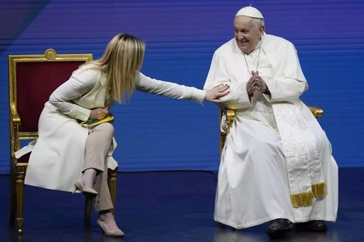FILE - Pope Francis and Giorgia Meloni attend a conference on birth rate, at Auditorium della Conciliazione, in Rome, Friday, May 12, 2023. (AP Photo/Alessandra Tarantino, File)