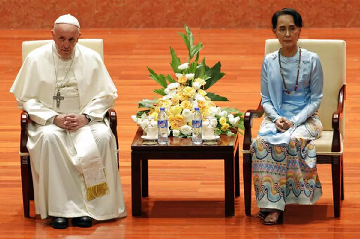 File - Pope Francis and Myanmar's leader Aung San Suu Kyi meet at the International Convention Centre of Naypyitaw, Myanmar, Tuesday, Nov. 28, 2017. (AP Photo/Andrew Medichini, file)