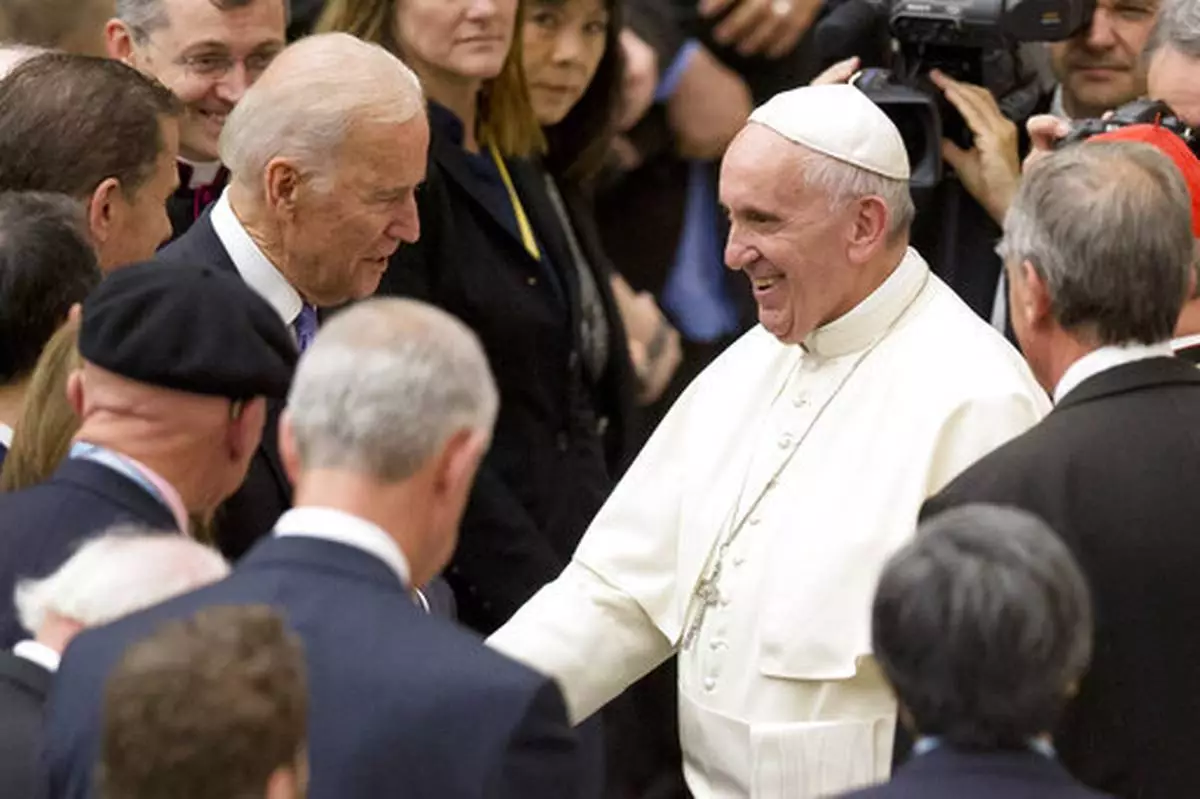 FILE - United States Vice President Joe Biden, left, shakes hands with Pope Francis during a congress on the progress of regenerative medicine held at the Vatican, Friday, April 29, 2016. (AP Photo/Andrew Medichini, File)