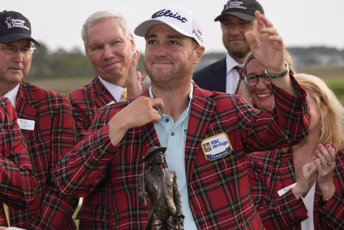 Justin Thomas celebrates after winning the RBC Heritage golf tournament, Sunday, April 20, 2025, in Hilton Head Island, S.C. (AP Photo/Mike Stewart)