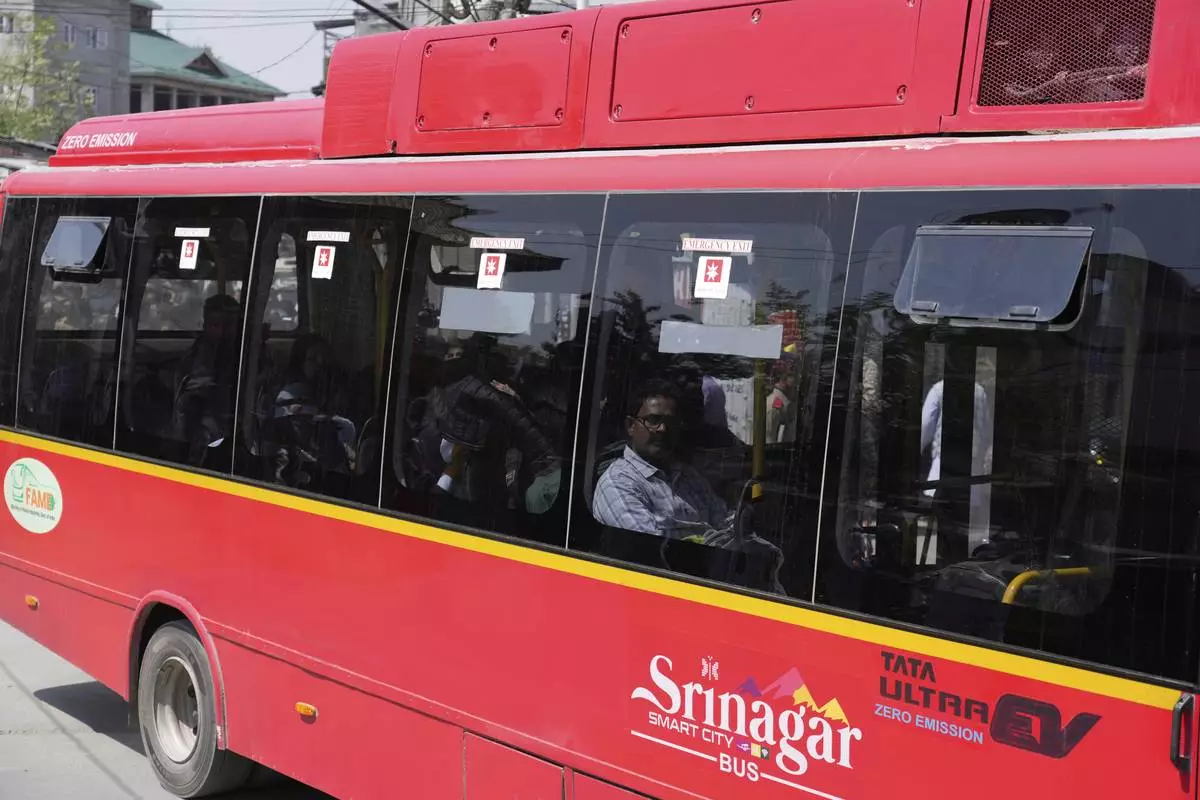 Relatives of and friends of killed tourists move in a bus towards airport in Srinagar, Indian controlled Kashmir, Wednesday, April. 23, 2025. (AP Photo/Mukhtar Khan)