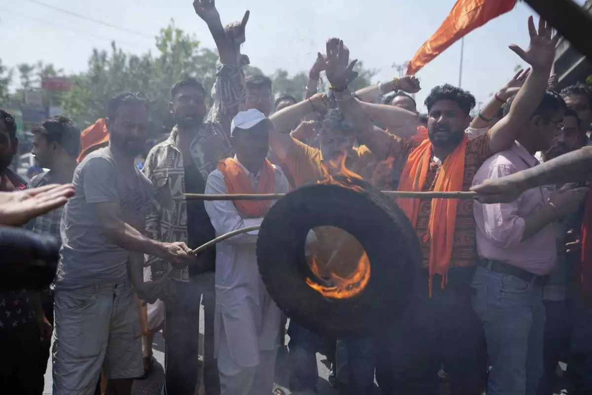 People shout slogans against Pakistan during a protest against the Pahalgam terror attack in Jammu, India, Wednesday, April 23, 2025.(AP Photo/Channi Anand)