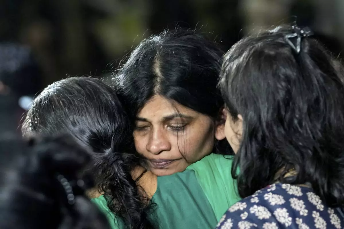 The wife of Sanjay Lele, who died in an attack on tourists in the Pahalgam region of Indian-administered Kashmir, reacts at Dombivali near Mumbai, India, Wednesday, April. 23, 2025.(AP Photo/Rajanish Kakade)