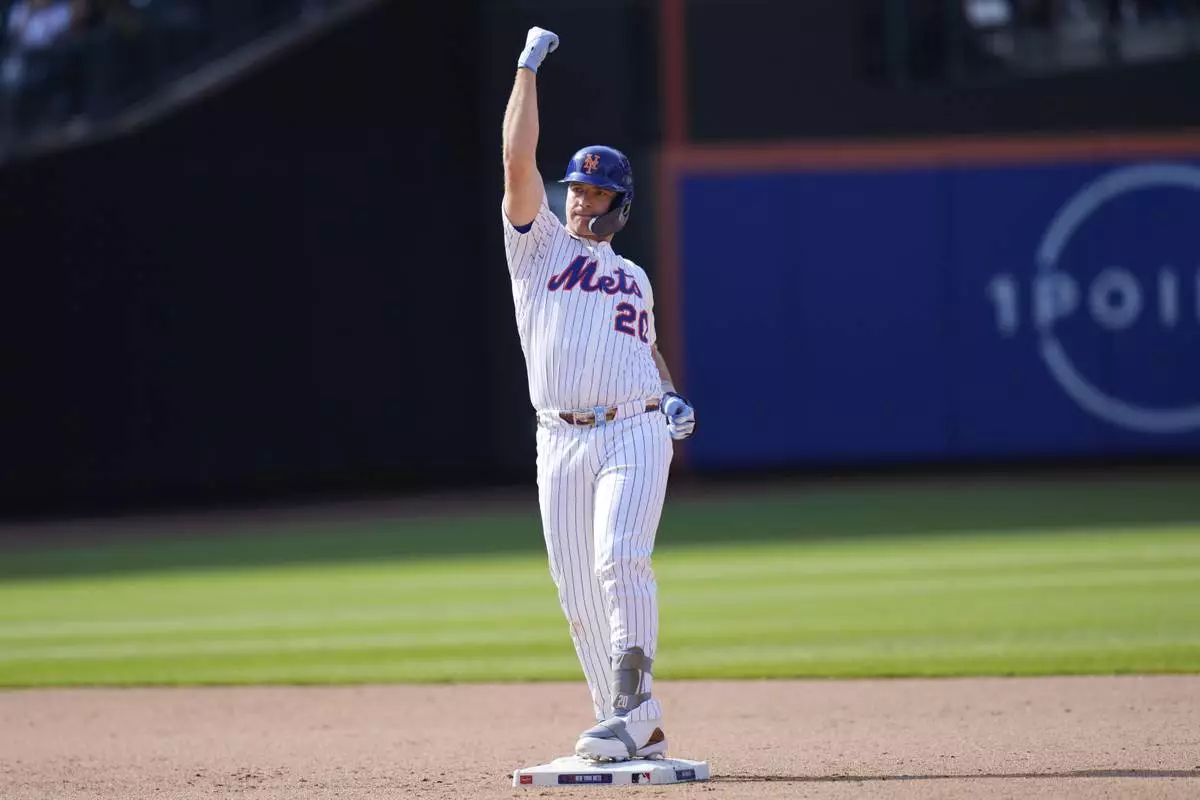 New York Mets' Pete Alonso reacts after hitting an RBI double during the tenth inning of a baseball game against the Philadelphia Phillies, Wednesday, April 23, 2025, in New York. (AP Photo/Seth Wenig)