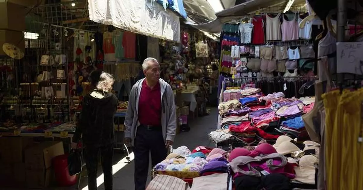 US inflation cools and Americans step up spending as they brace for tariff impact