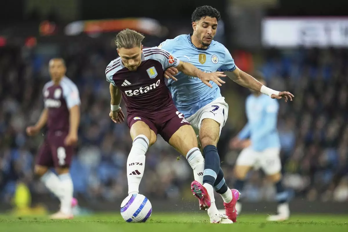 Manchester City's Omar Marmoush, right, challenges for the ball with Aston Villa's Matty Cash during the English Premier League soccer match between Manchester City and Aston Villa at Etihad stadium in Manchester, England, Tuesday, April 22, 2025. (AP Photo/Jon Super)