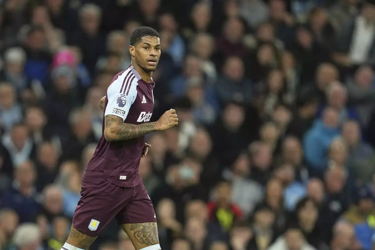 Aston Villa's Marcus Rashford reacts after missing a scoring chance during the English Premier League soccer match between Manchester City and Aston Villa at Etihad stadium in Manchester, England, Tuesday, April 22, 2025. (AP Photo/Jon Super)