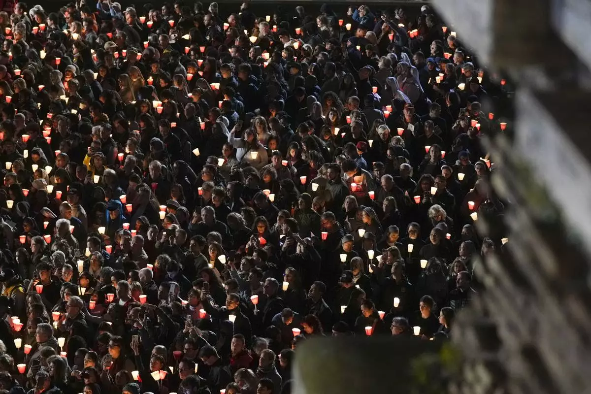 Faithful attend the Way of the Cross procession, inside the Colosseum in Rome, on Good Friday, April 18, 2025. (AP Photo/Andrew Medichini)