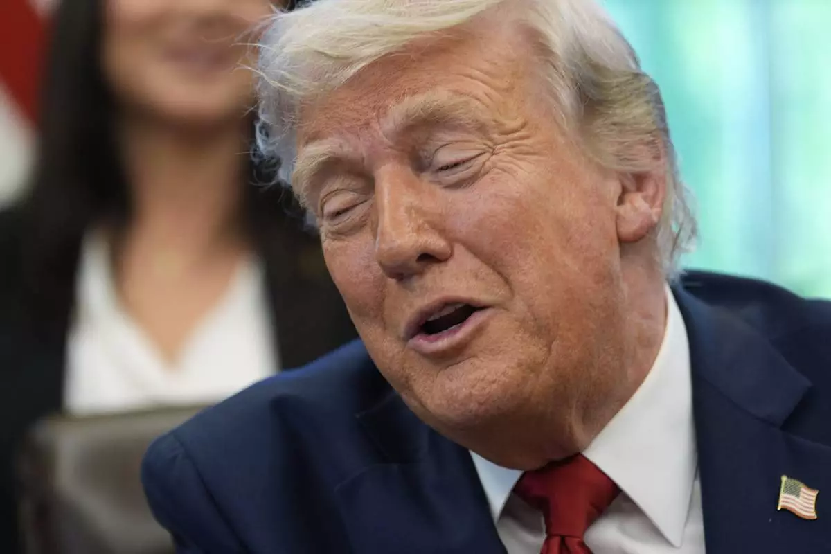 President Donald Trump speaks with reporters after signing executive orders in the Oval Office of the White House, Wednesday, April 23, 2025, in Washington. (AP Photo/Alex Brandon)