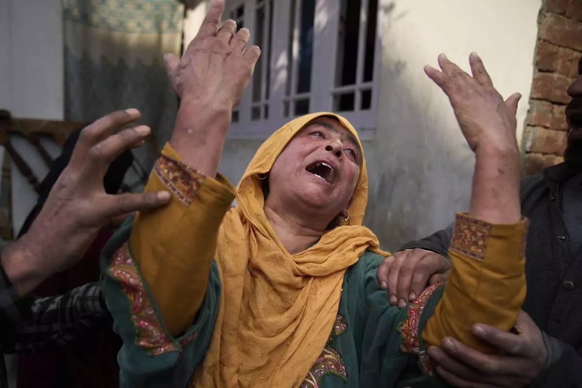 A relative of Ahsan Ul Haq Shiekh, a militant who officials say is involved in the deadly attack on tourists in Pahalgam, wails after Indian forces blew up the family home at Murran village in Pulwama, south of Srinagar, Indian controlled Kashmir, Saturday, April 26, 2025. (AP Photo/Dar Yasin)