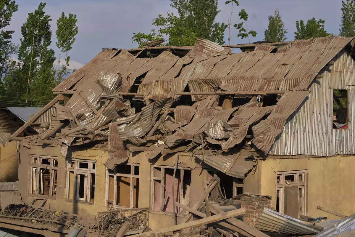 Blown-up family home of Ahsan Ul Haq Shiekh, a militant who officials say is involved in the deadly attack on tourists in Pahalgam, is seen at Murran village in Pulwama, south of Srinagar, Indian controlled Kashmir, Saturday, April 26, 2025. (AP Photo/Dar Yasin)