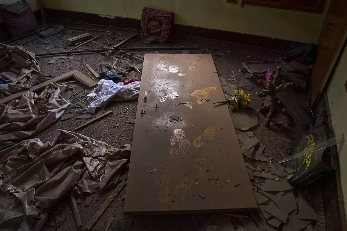 The damage in a neighbouring house is seen after Indian forces blew up the family home of Ahsan Ul Haq Shiekh, a militant who officials say is involved in the deadly attack on tourists in Pahalgam, at Murran village in Pulwama, south of Srinagar, Indian controlled Kashmir, Saturday, April 26, 2025. (AP Photo/Dar Yasin)