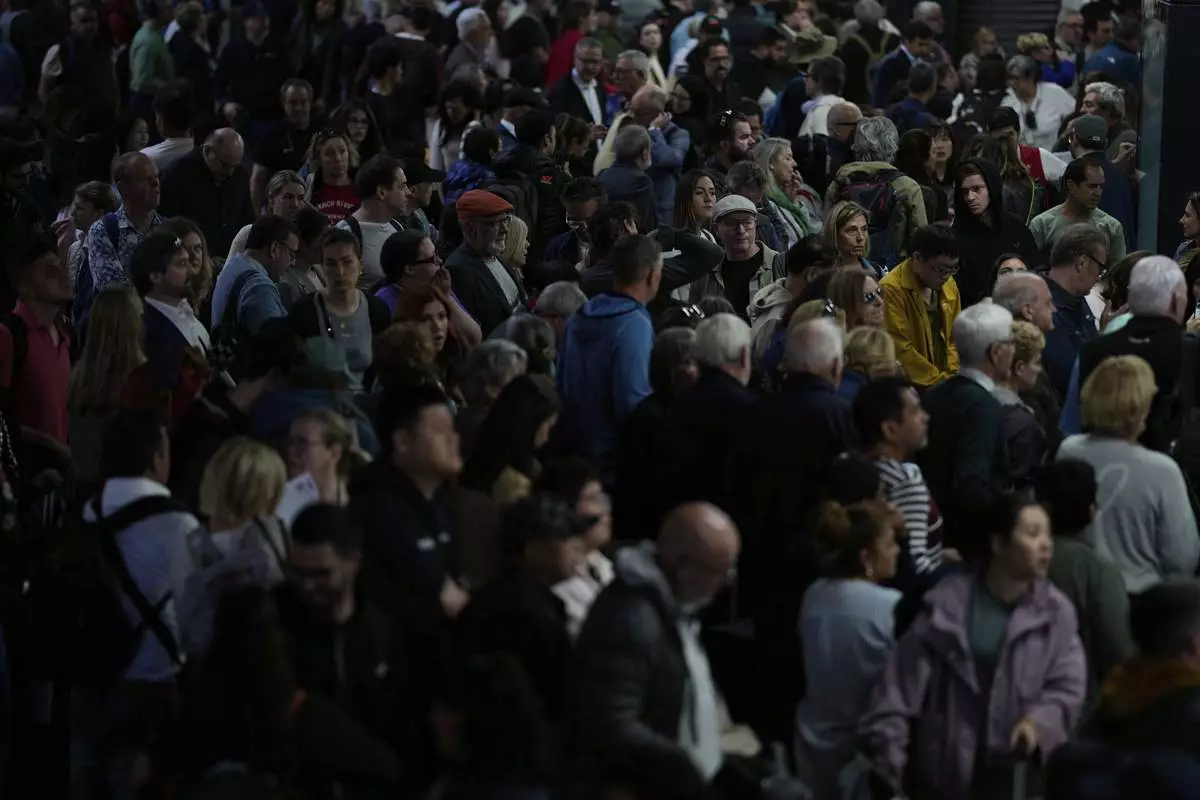 Passengers inside Atocha train station the day after a major power outage in Madrid, Tuesday, April 29, 2025. (AP Photo/Manu Fernandez)