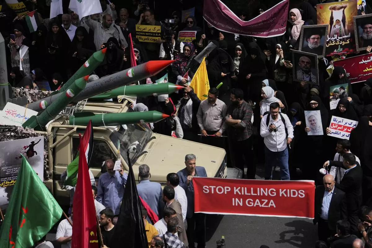 Replicas of some missiles are carried on a truck during an anti-Israel demonstration at the Felestin (Palestine) Sq. in Tehran, Iran, Wednesday, April 9, 2025. (AP Photo/Vahid Salemi)