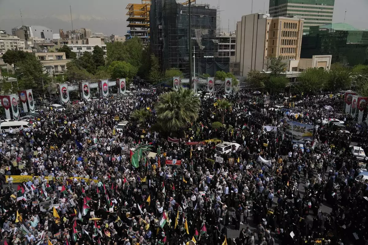 Iranian protesters attend an anti-Israeli demonstration at the Felestin (Palestine) Sq. in Tehran, Iran, Wednesday, April 9, 2025. (AP Photo/Vahid Salemi)