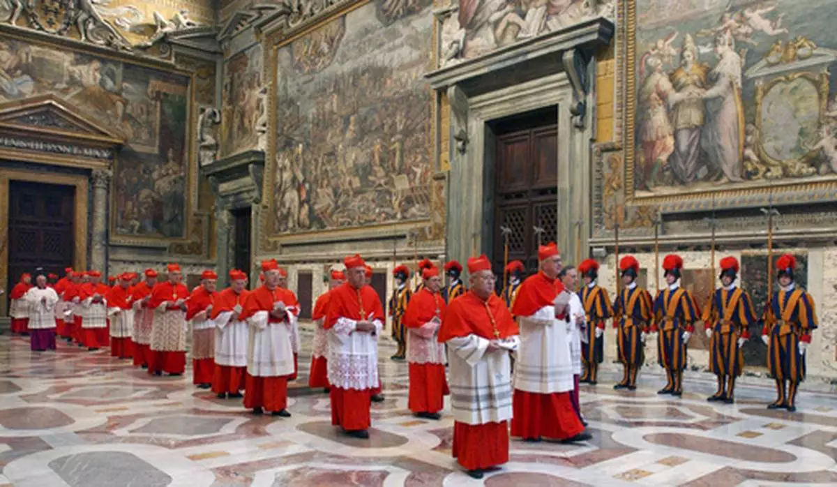 FILE - In this photo from files taken on April 18, 2005 and released by the Vatican paper L'Osservatore Romano, Cardinals walk in procession to the Sistine Chapel at the Vatican, at the beginning of the conclave. (Osservatore Romano via AP, File)