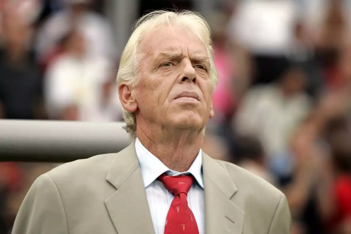 FILE - Trinidad and Tobago's coach Leo Beenhakker listens to the national anthems before their World Cup Group B soccer match against England in Nuremberg, Germany, Thursday, June 15, 2006. (AP Photo/Matt Dunham, File)