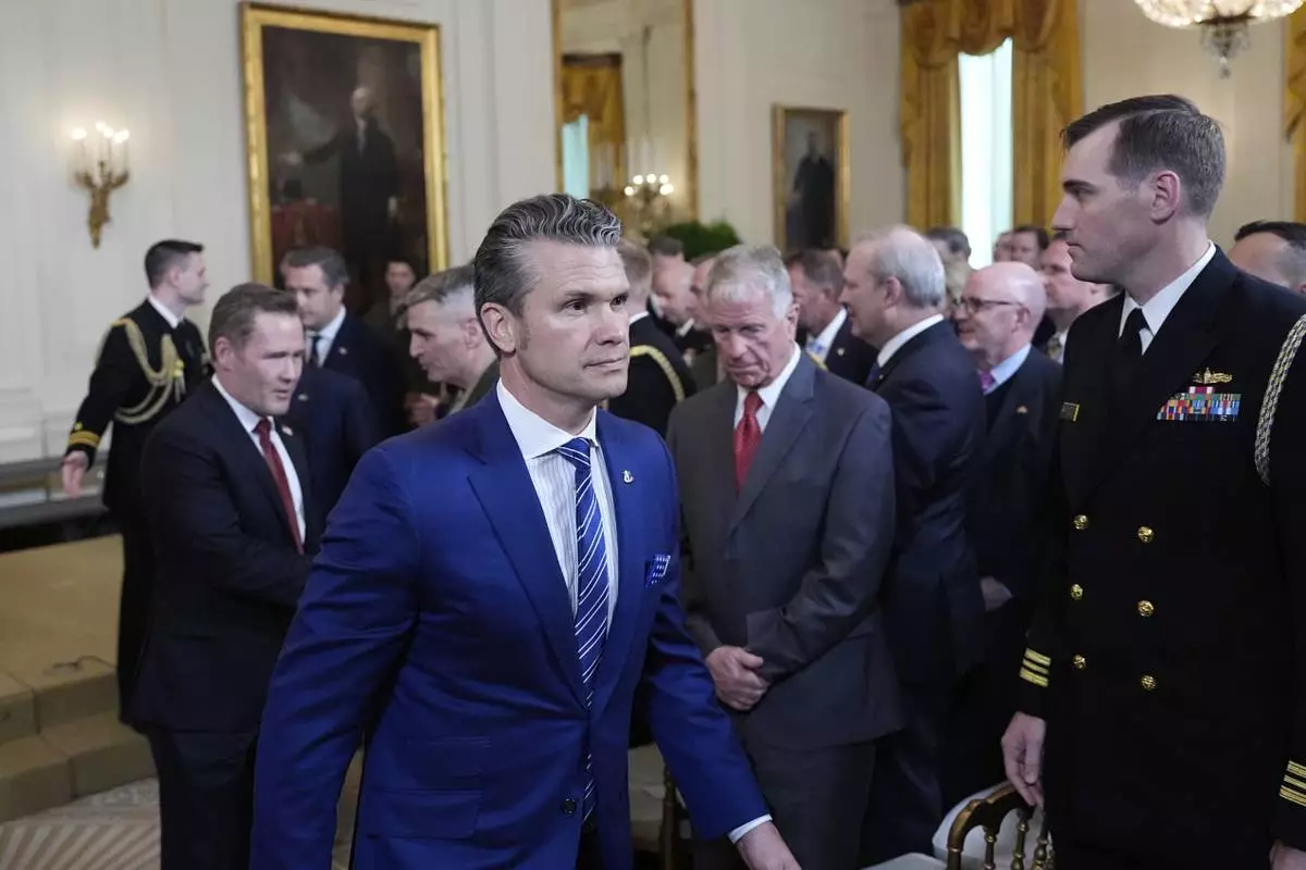 Defense Secretary Pete Hegseth departs the Commander-in-Chief trophy presentation to the Navy Midshipman football team in the East Room of the White House, Tuesday, April 15, 2025, in Washington. (AP Photo/Alex Brandon)